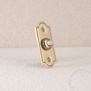 Bouton poussoir avec plaque dorée