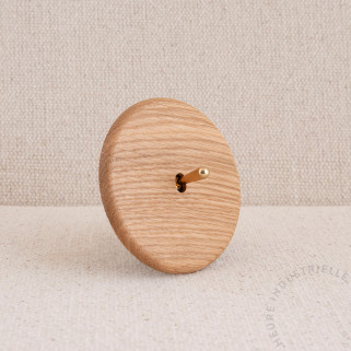 Interrupteur simple Modelec Iris chêne clair levier laiton brillant